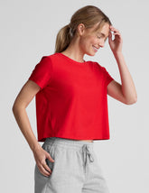 red cropped loose-fitting t-shirt with a scooped neckline.